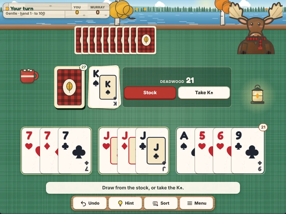 Actual Birch Cove Gin Rummy gameplay on a desktop browser: a green felt card table on a lakeside dock, your hand along the bottom sorted into melds on their own mats with the loose cards at the end under a deadwood badge, the stock and the discard pile in the middle beside a panel with the deadwood count and the next action, Murray’s face-down cards across the table, Murray the moose watching from the right, and Undo, Hint, Sort and Menu on the shelf below.