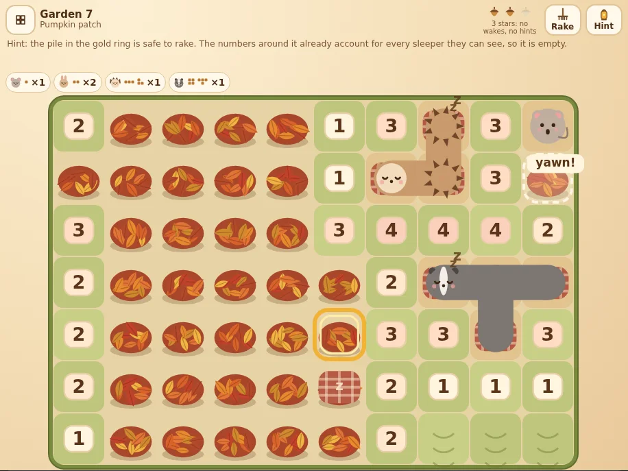 Actual Leaf Pile Nap gameplay in garden 7, Pumpkin patch, turned sideways on a wide screen: leaf piles and raked lawn tiles with numbers from 1 to 4, a badger shaped like a T and a bent hedgehog tucked in under striped blankets with little z letters, a mouse that just woke up saying yawn with a dashed ring on the pile beside it, a blanket laid on a hidden rabbit, and a gold ring on the pile a hint proved empty. The header shows two of three acorns, the Rake and Hint buttons, the hint explaining that the numbers around the pile already account for every sleeper they can see, and chips for the animals still hidden.